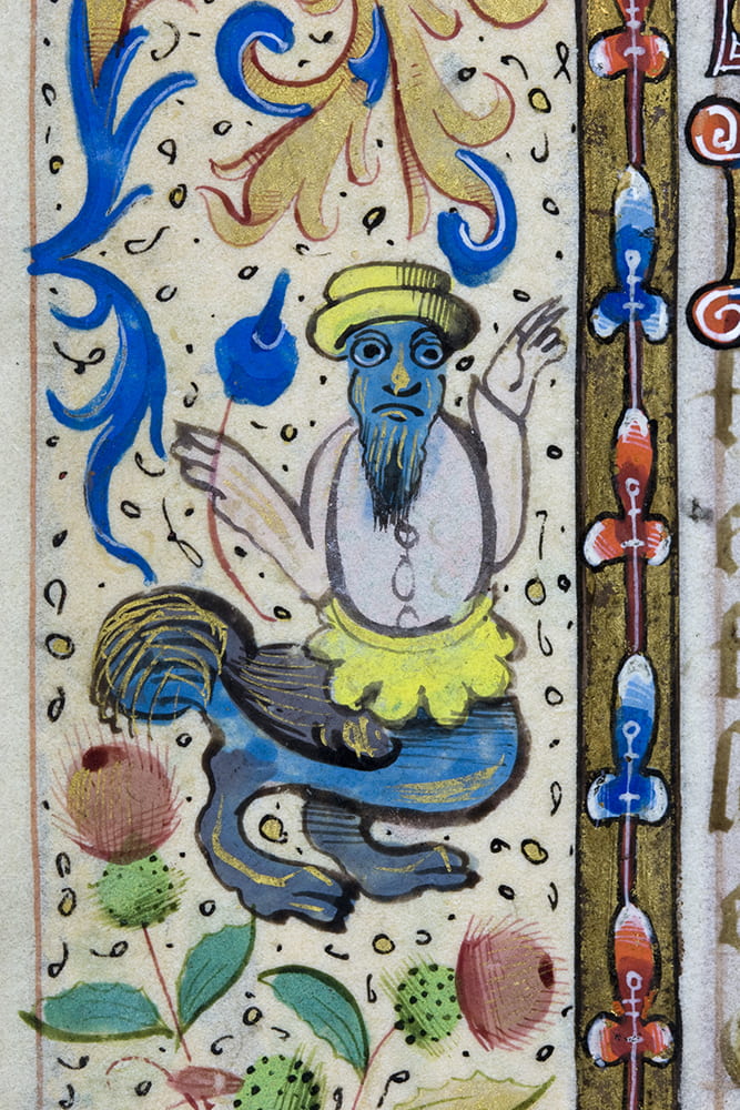 A grotesque or drollery, perhaps serving as a mnemonic, in the margin of a folio in the Cobden Book of Hours. DM832.